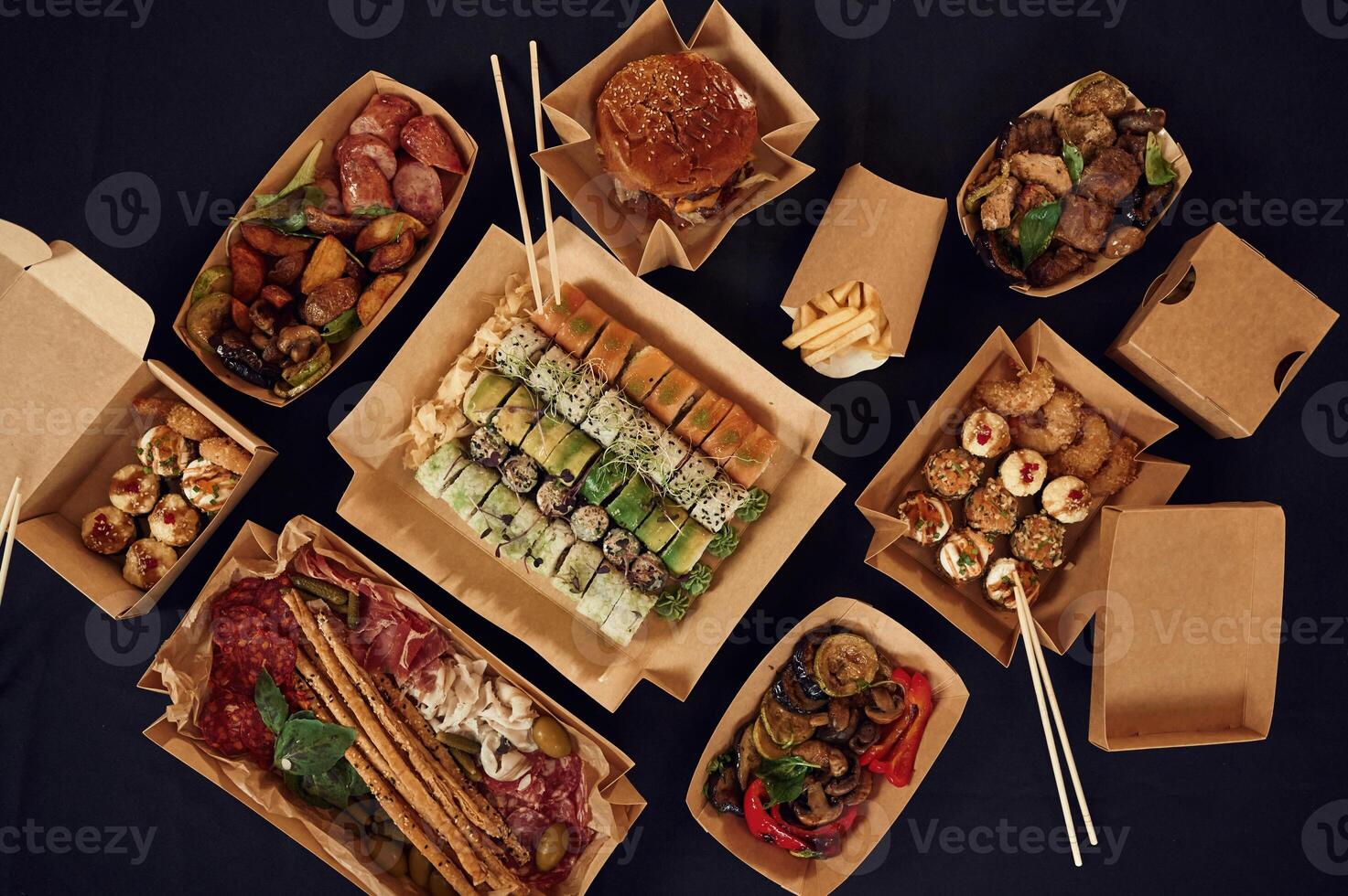 Top view of table with food ,on it. Meat,, vegetables, sushi, French fries, burger, mushrooms photo