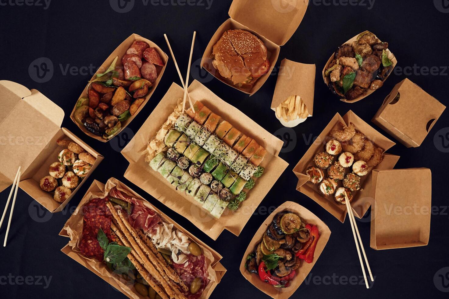 Top view of, table, with food on it. Meat, vegetables, sushi, French fries, burger, mushrooms photo
