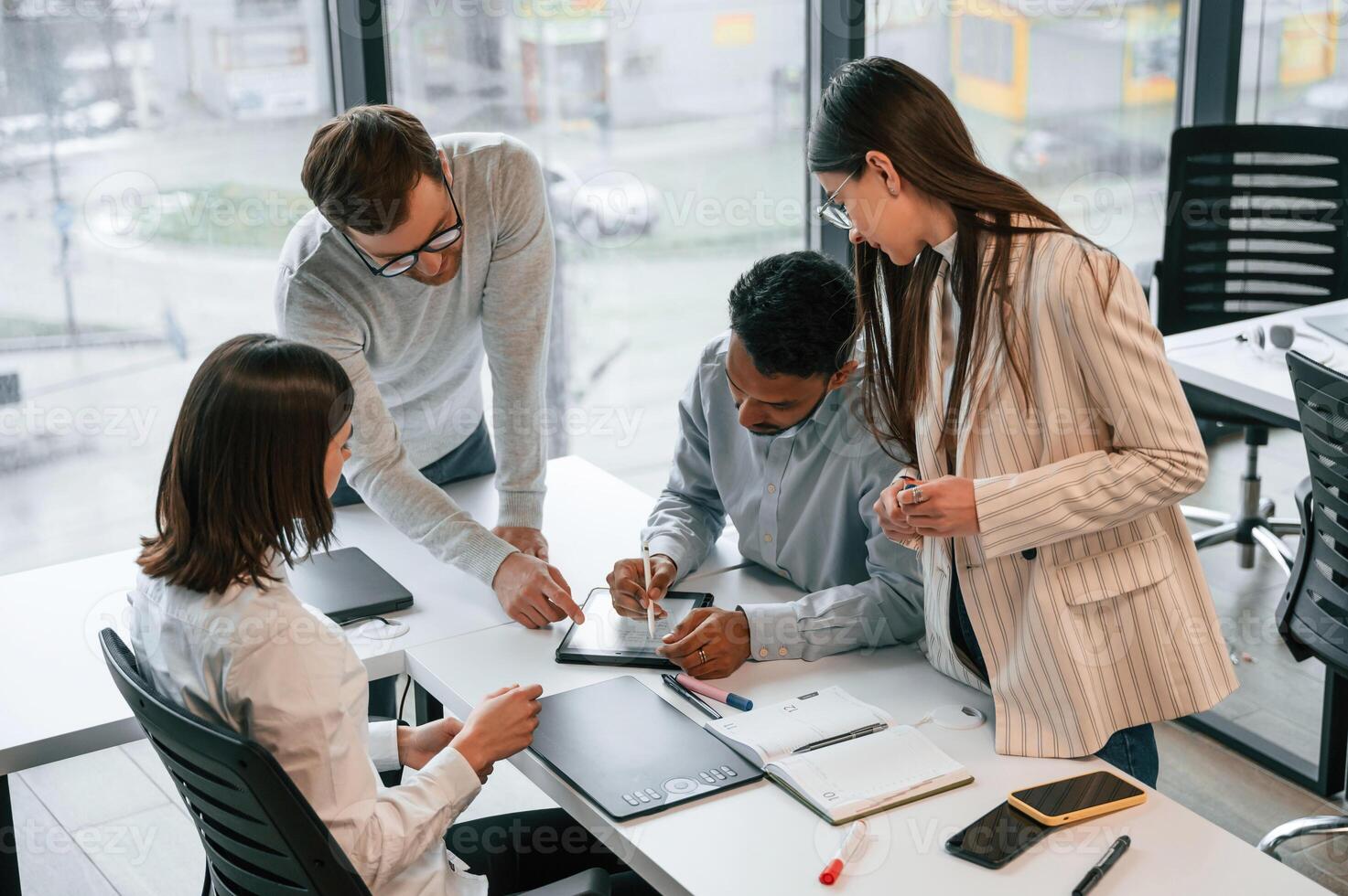 Conception, of brainstorming. Four people are working in the office together photo