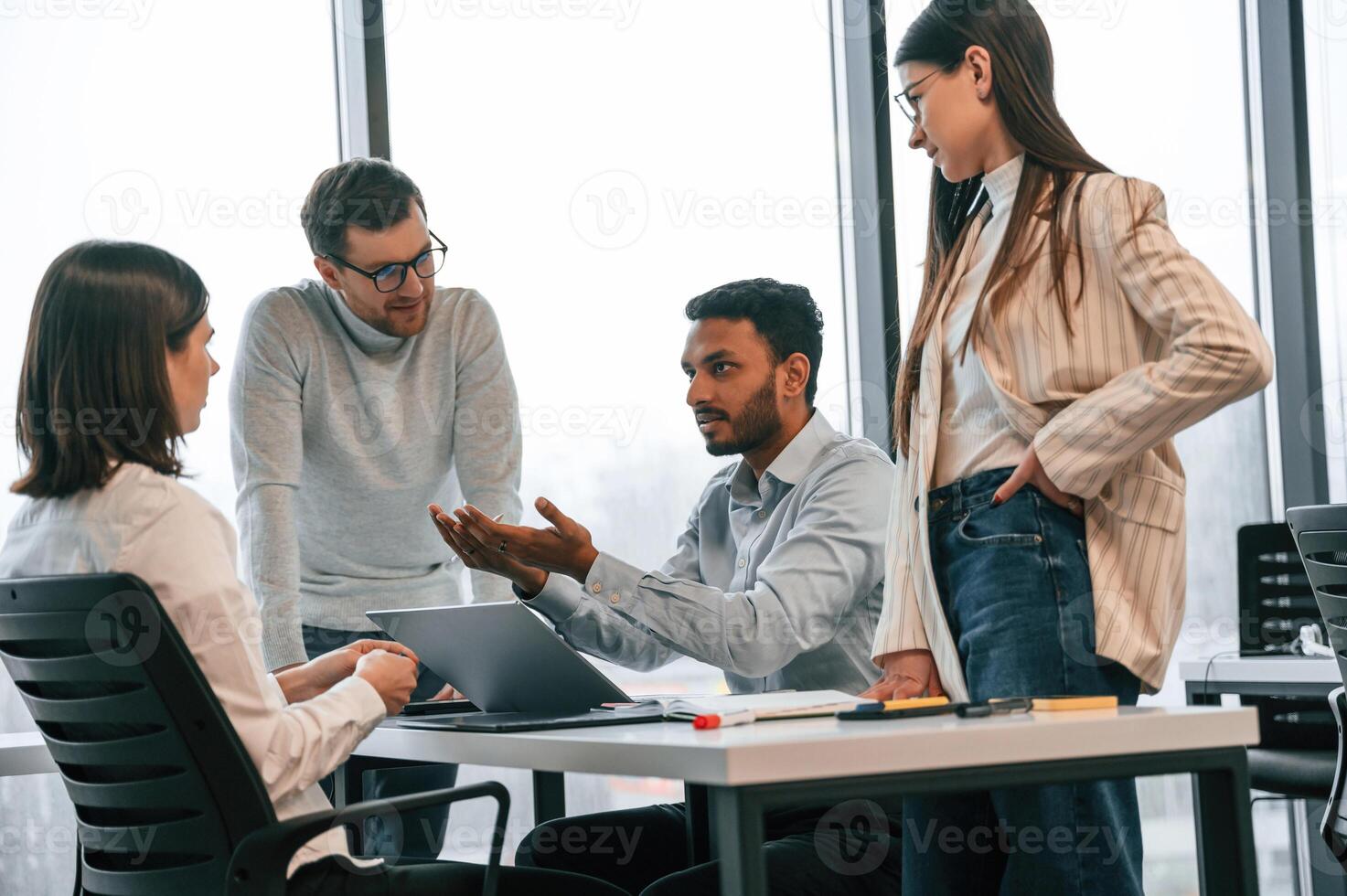 Conception, of, brainstorming. Four people are working in the office together photo