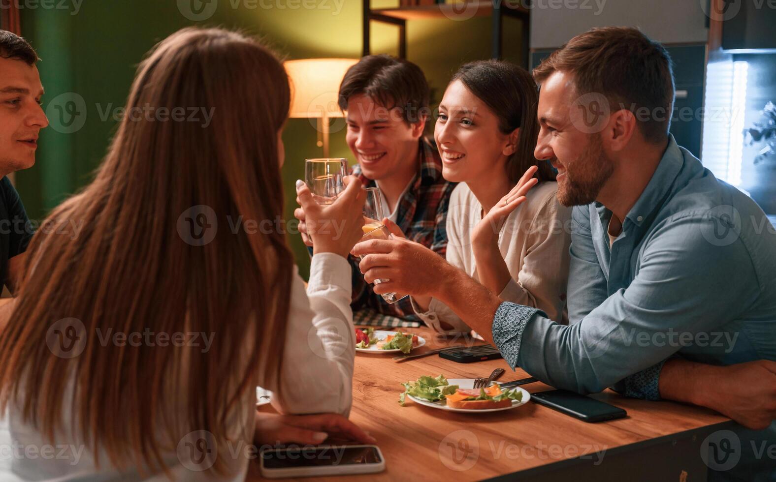 Group, of people are, on the kitchen, having dinner, spending time together photo