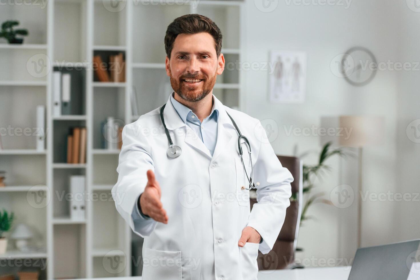 With ,stethoscope.. Doctor in formal clothes is working in the cabinet photo