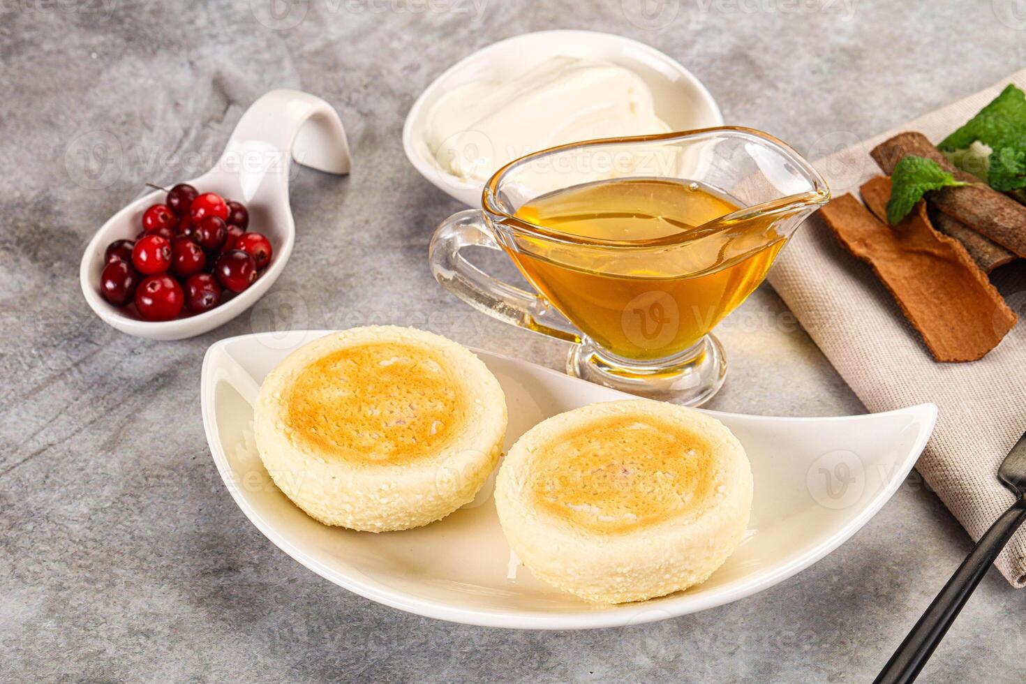 A table with a bowl of food and a cup of tea photo