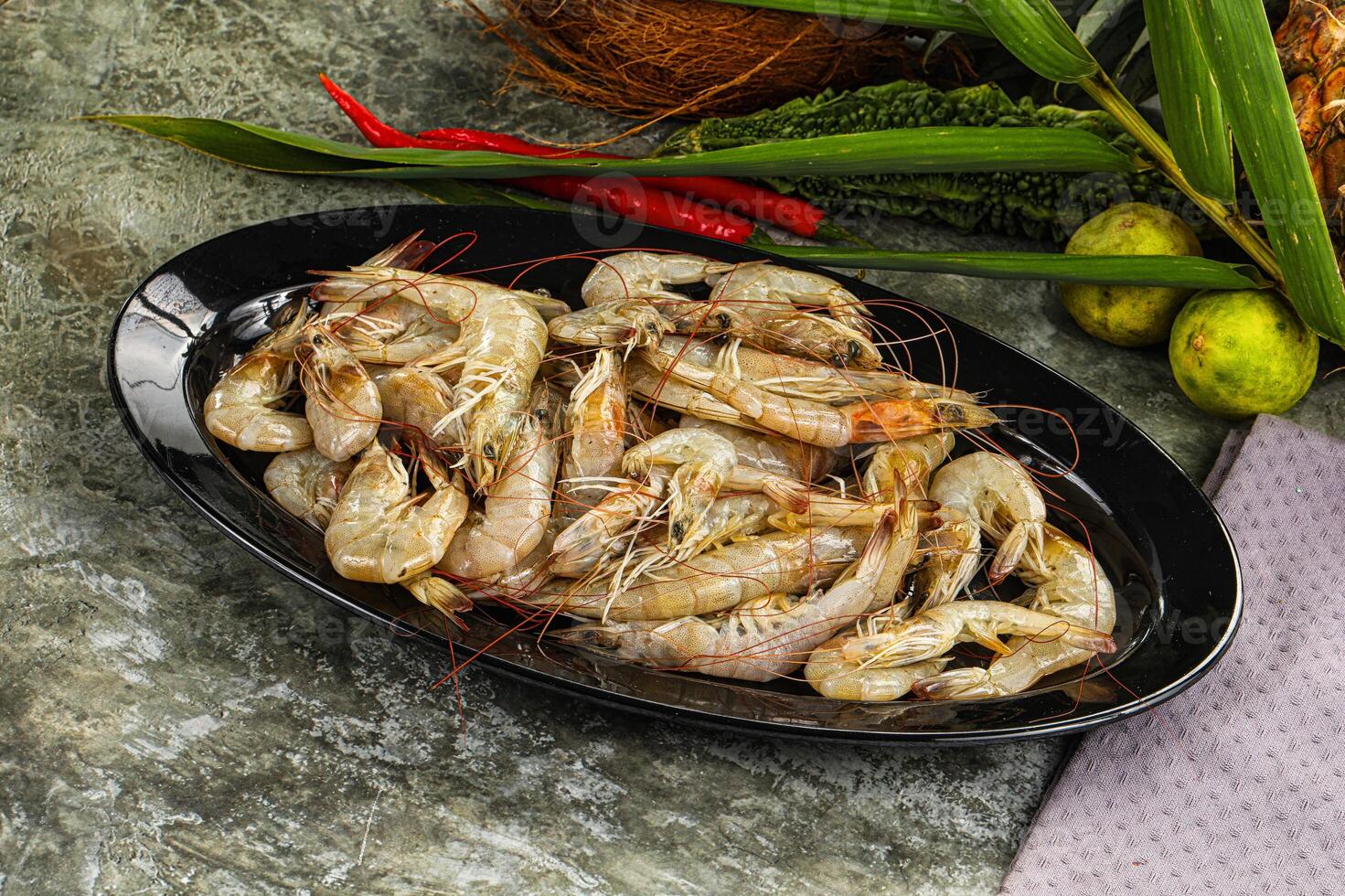 A plate of cooked shrimp on a table photo
