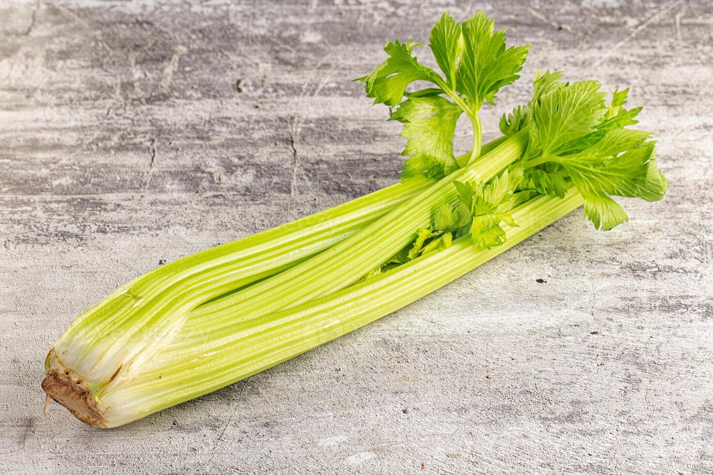 A celery root on a wooden surface photo