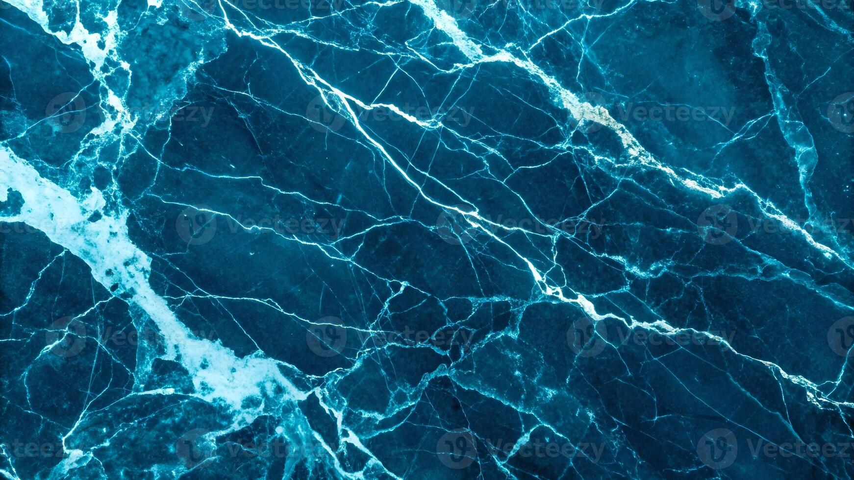Dark blue marble texture with intricate white veining, perfect for backgrounds and design elements requiring a touch of natural elegance and sophistication. photo