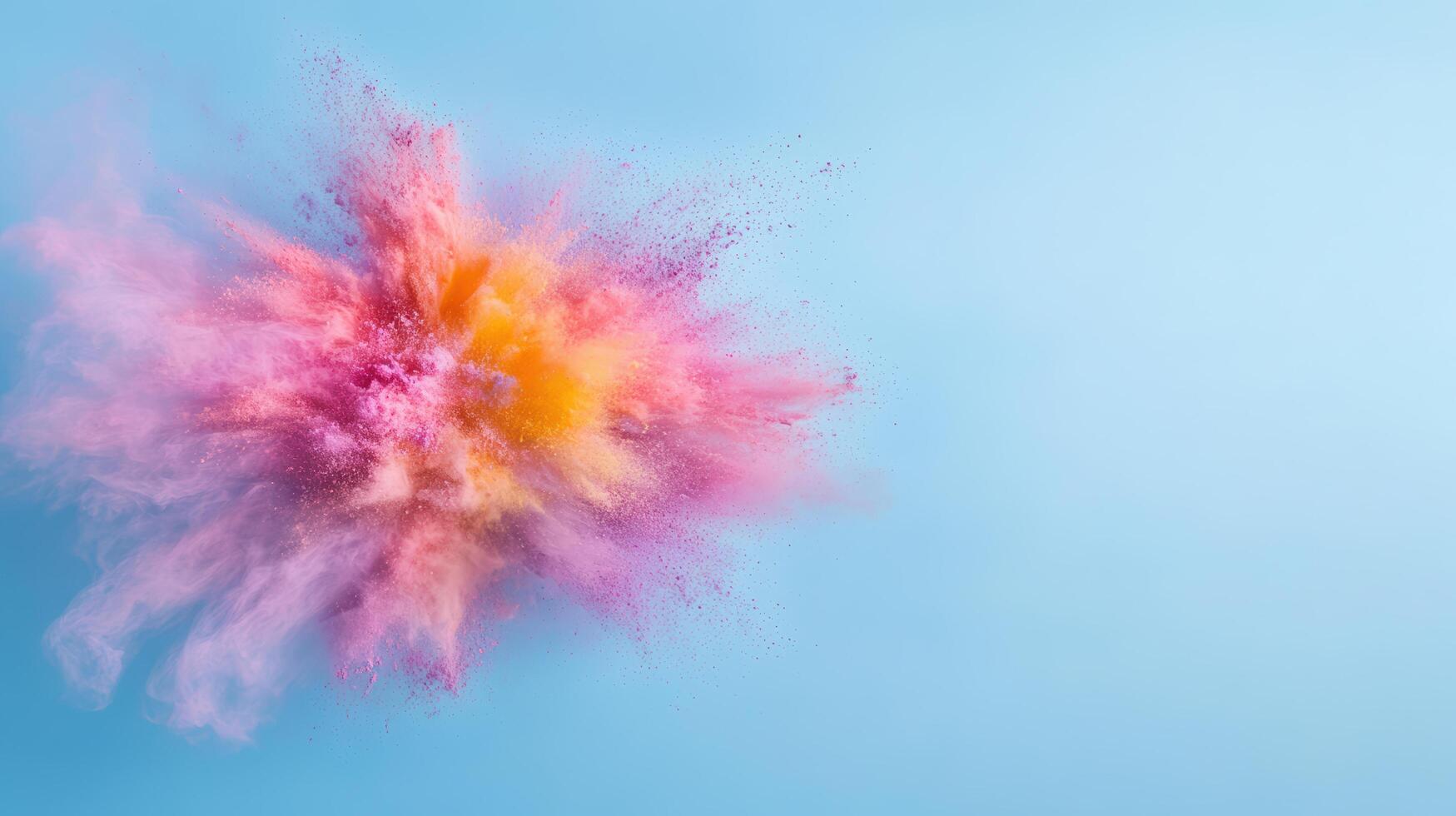 vibrant explosion of colorful powder creates mesmerizing effect against light blue background photo