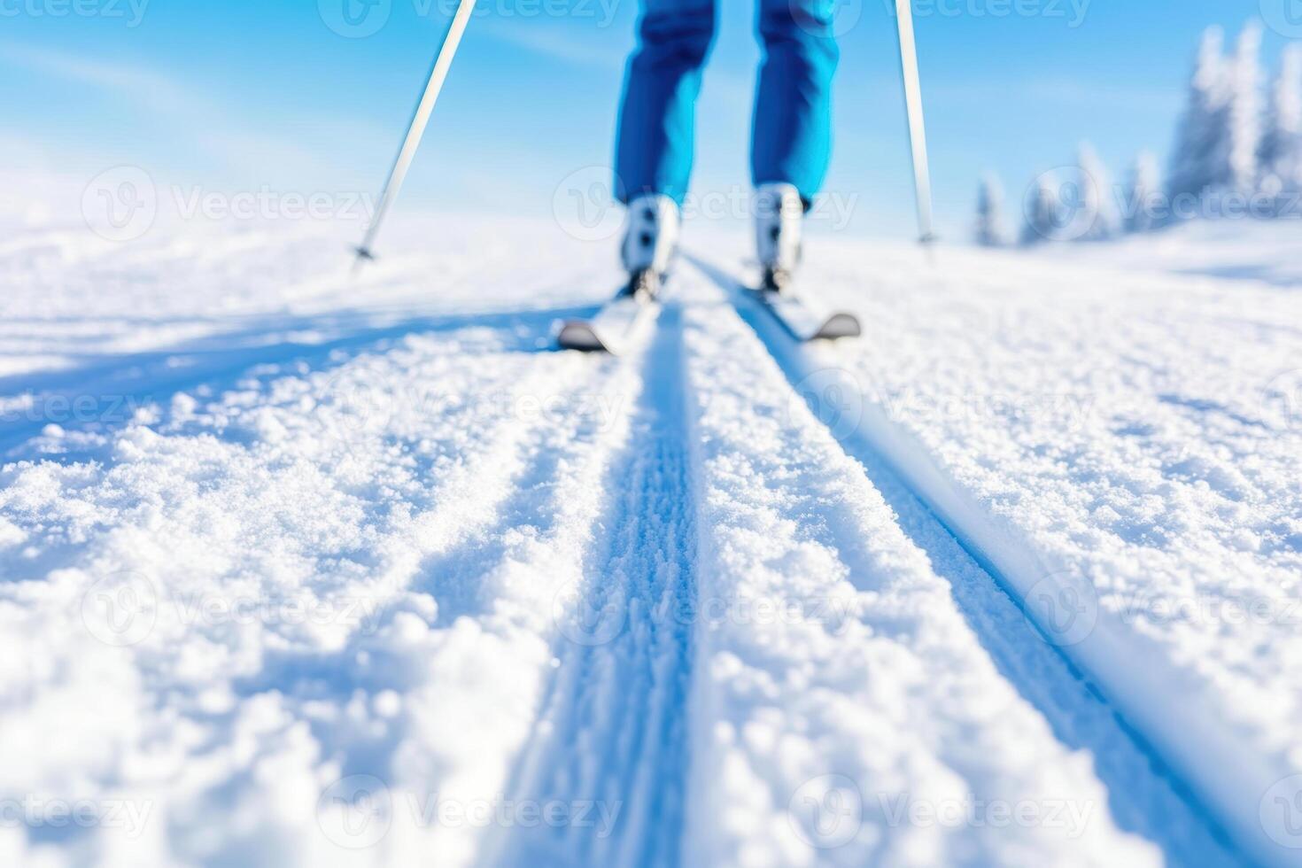 Cross country skiing in snowy landscape with bright blue sky and pristine winter conditions for outdoor adventure photo