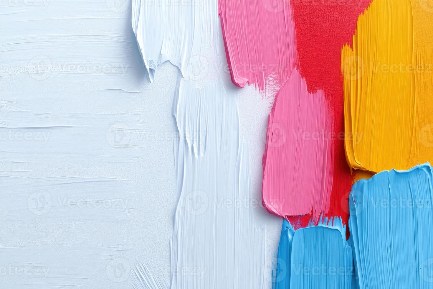 Colorful palette of vivid brushstrokes featuring blue, pink, and yellow paint textures on canvas highlighting artistic creativity and expression photo