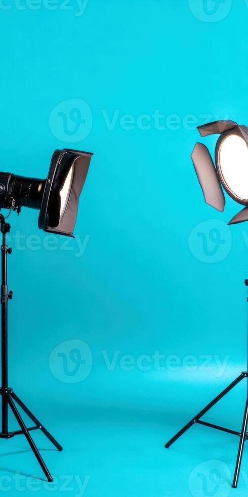Professional studio lights on turquoise backdrop creative equipment setup concept photo