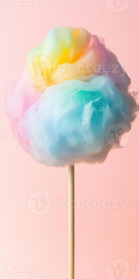 Multicolored cotton candy on stick with pastel background showcasing sweetness and soft textures photo