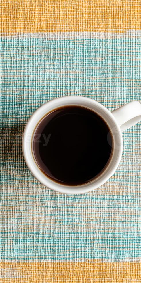 Morning Coffee Cup on Colorful Woven Tablecloth for Cozy Atmosphere photo