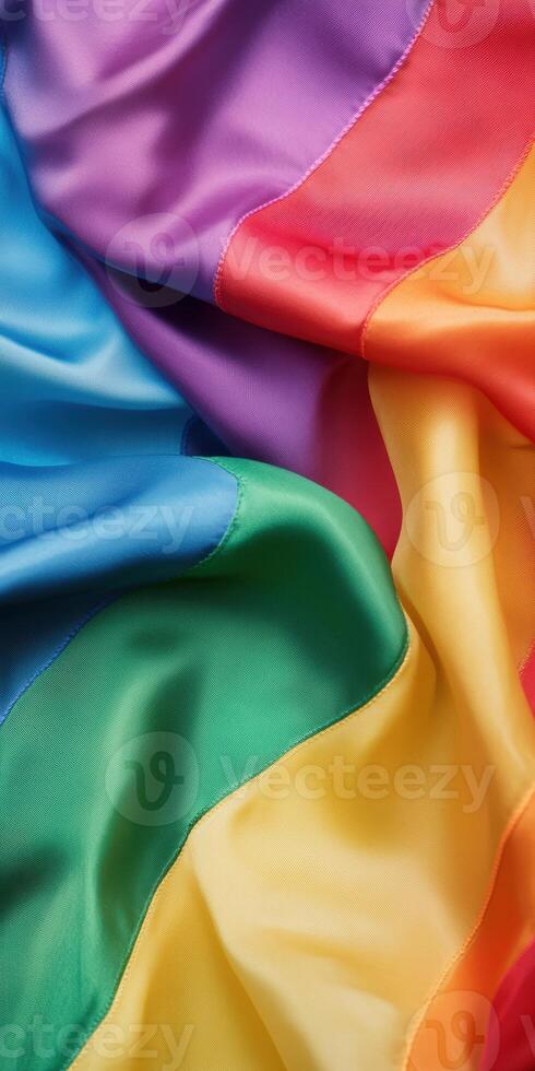 Vibrant rainbow silk fabric with flowing colorful waves symbolizing diversity and pride, photo