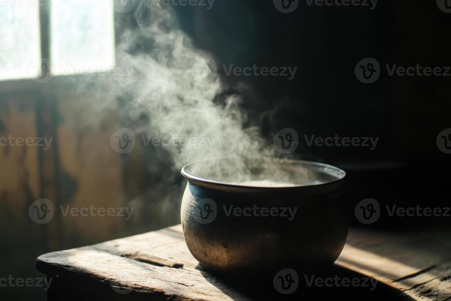 Steam rising from a rustic metal pot on wooden table in sunlit room, photo