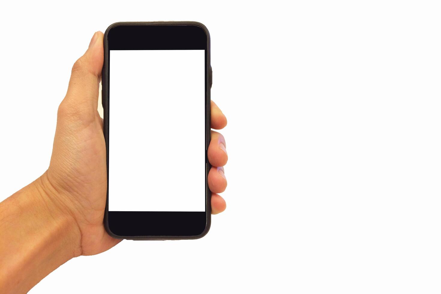 Hand holding smartphone on white background photo