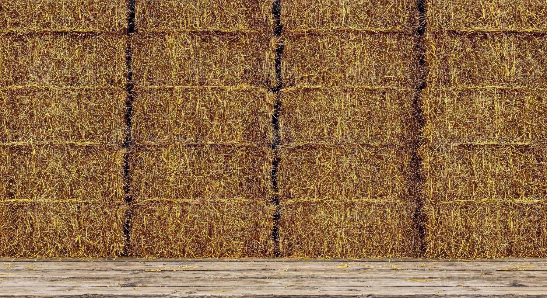 A room with a wooden floor and hay bales photo