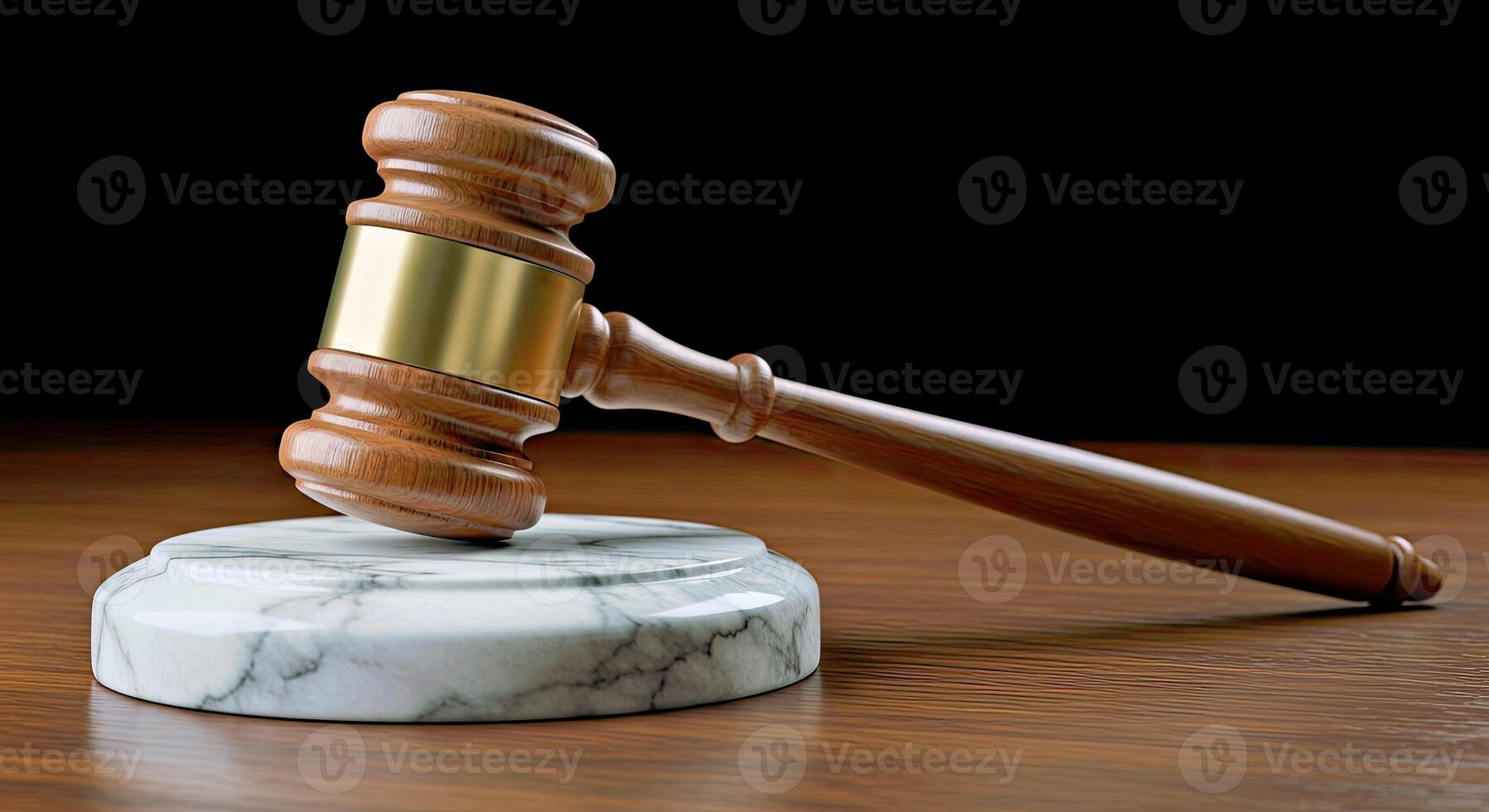 A judge's gavel on a marble stand photo