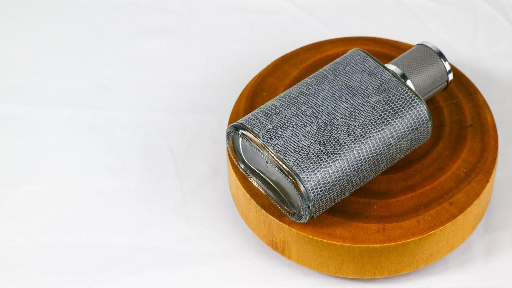 a gray and black metal pipe sitting on top of a wooden stand photo