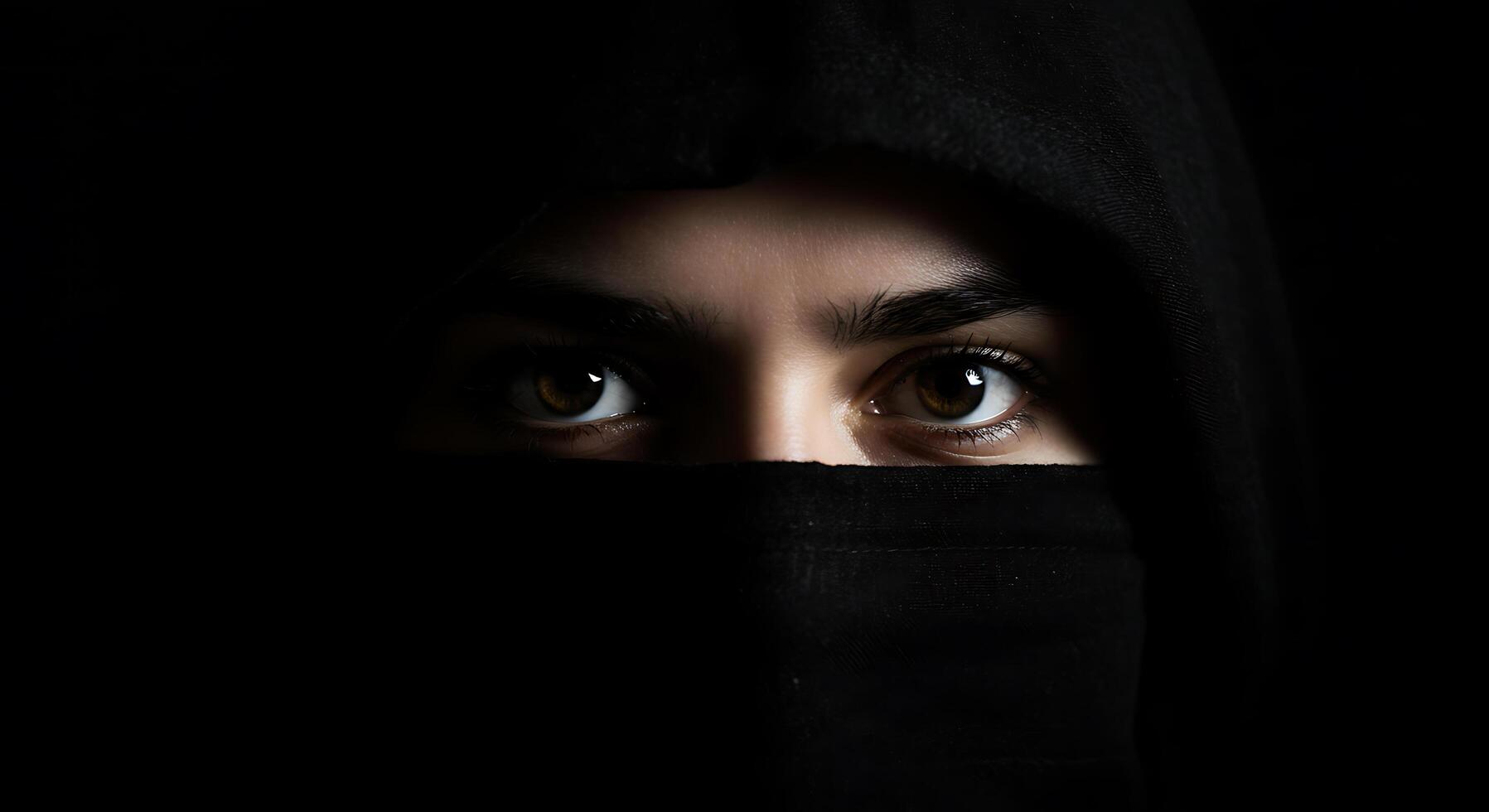 Mysterious Gaze Dark Hooded Figure with Intense Eyes photo