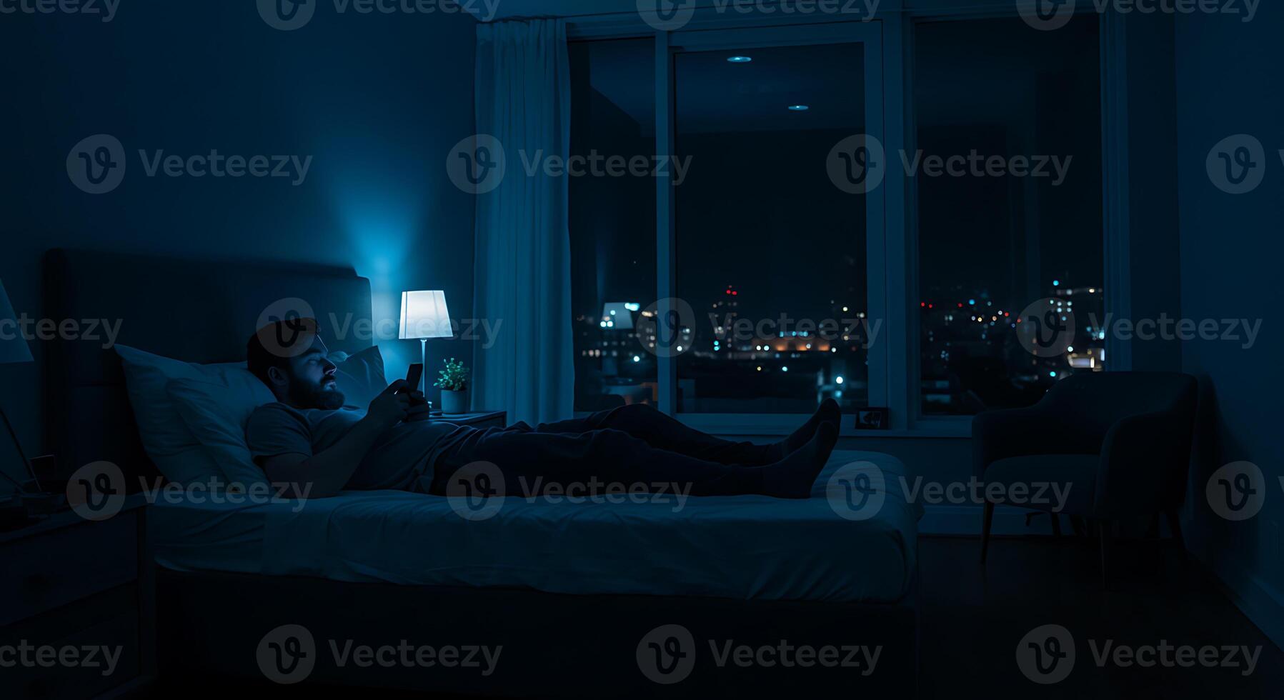 Nighttime Solitude A Man on a Bed City Lights Gleaming photo