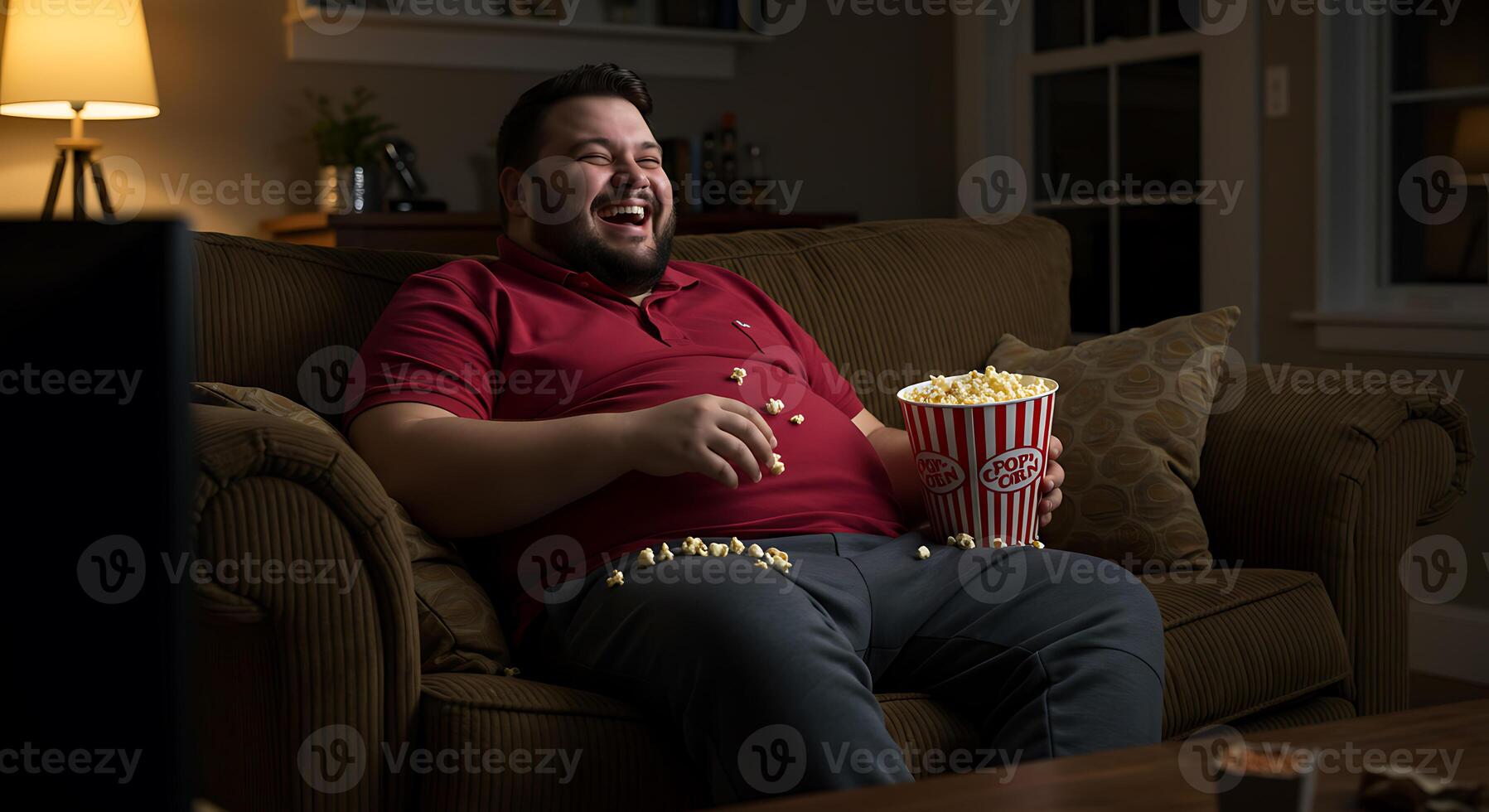 Joyful Man Enjoys Movie Night with Popcorn A Warm Evening Scene photo