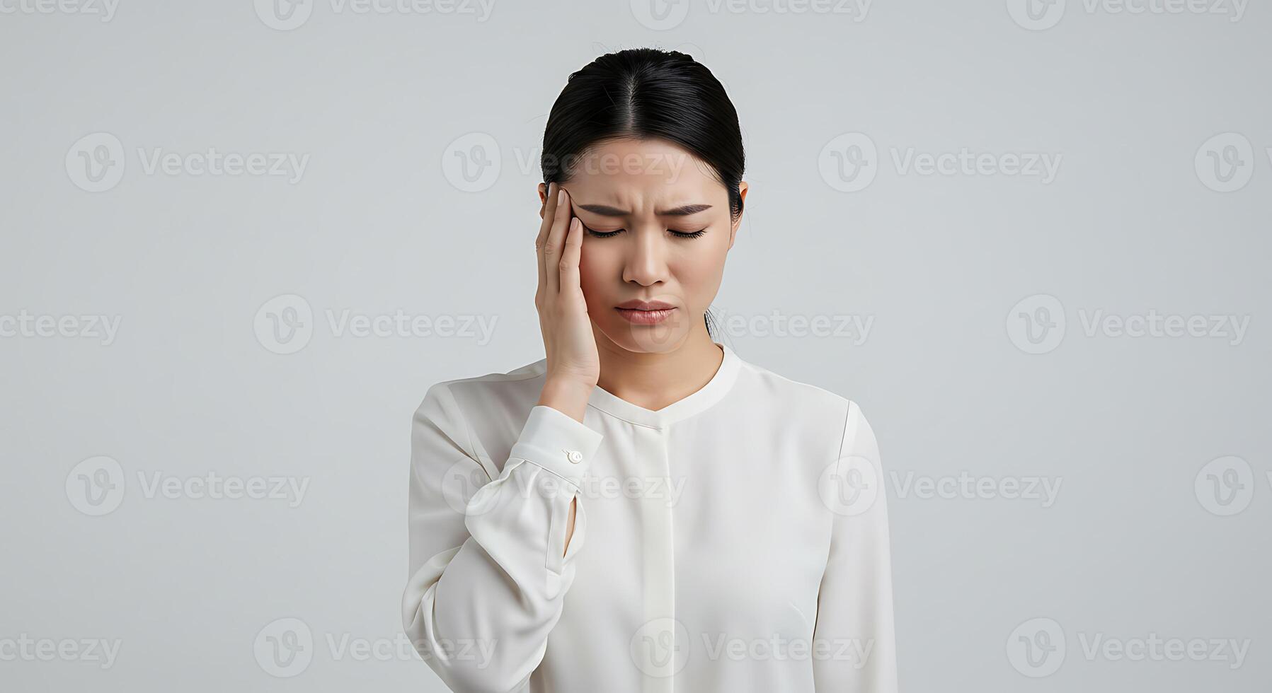 Woman in White Blouse Head in Hand A Portrait of Quiet Distress photo