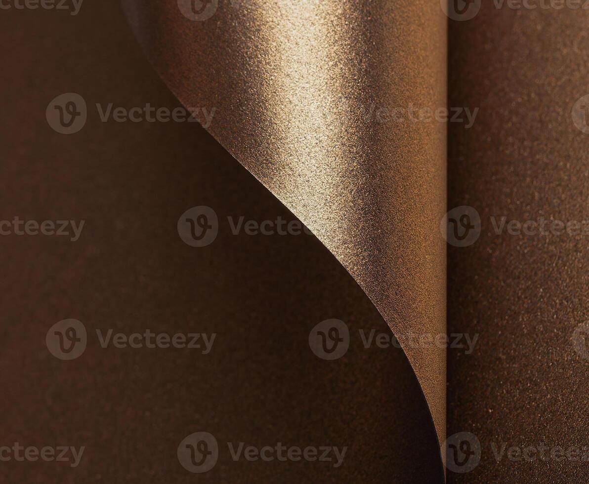 Elegant gold and bronze paper background with a glossy, pearlescent texture. Shimmering metallic photo