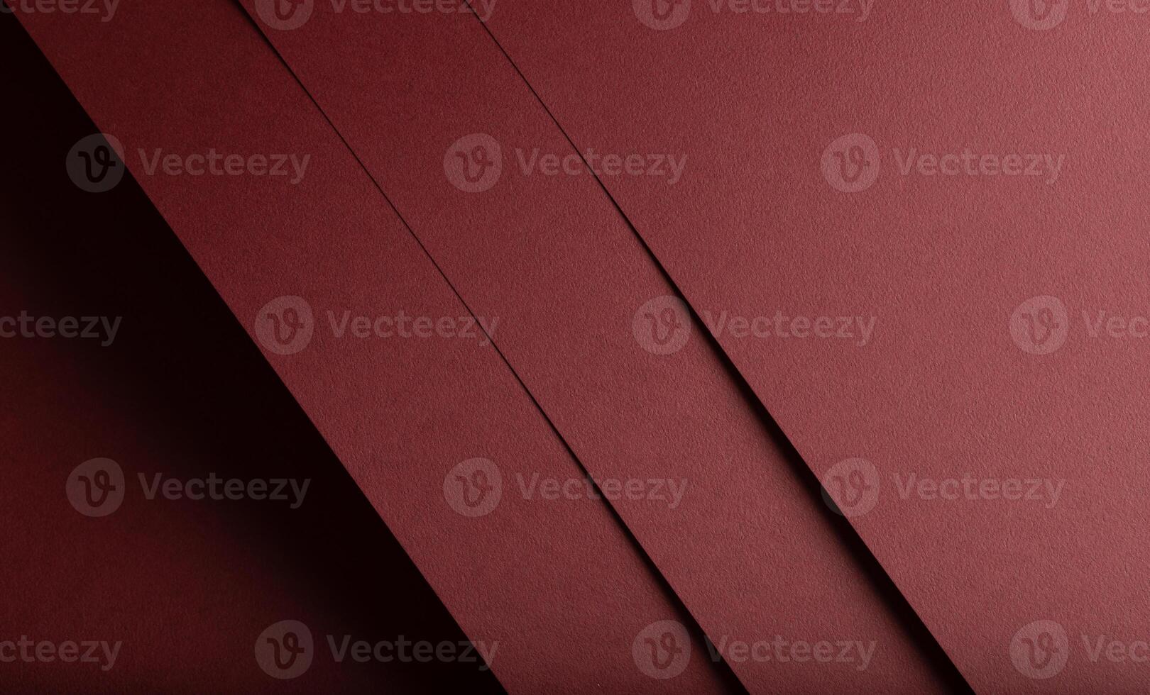 Deep burgundy paper background with a grainy texture and matte finish. Elegant, rich tones create an photo