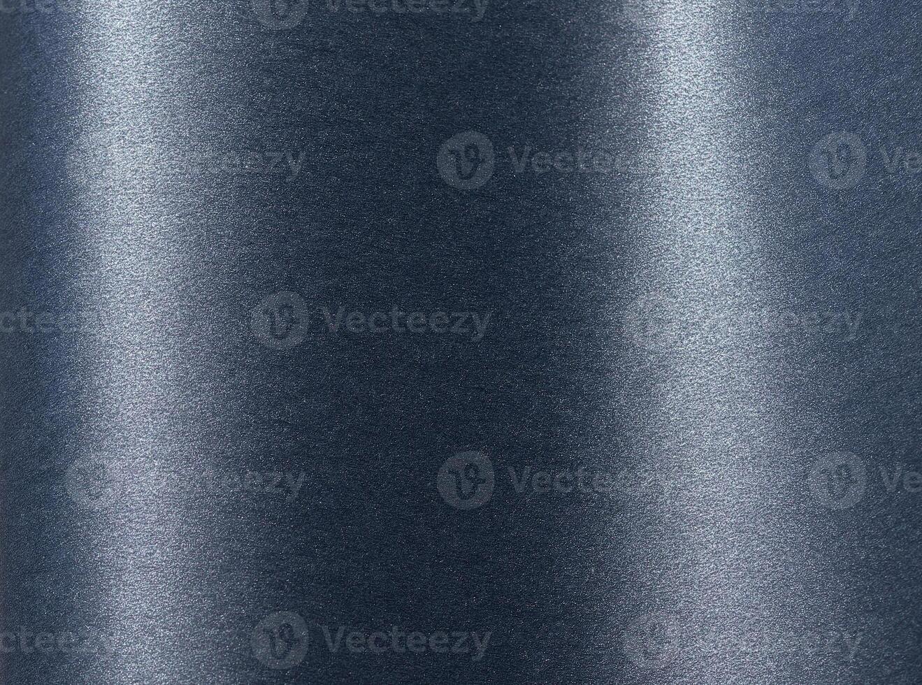 Blue paper background with a smooth, sleek texture and subtle shimmering finish. Rich, cool tones photo