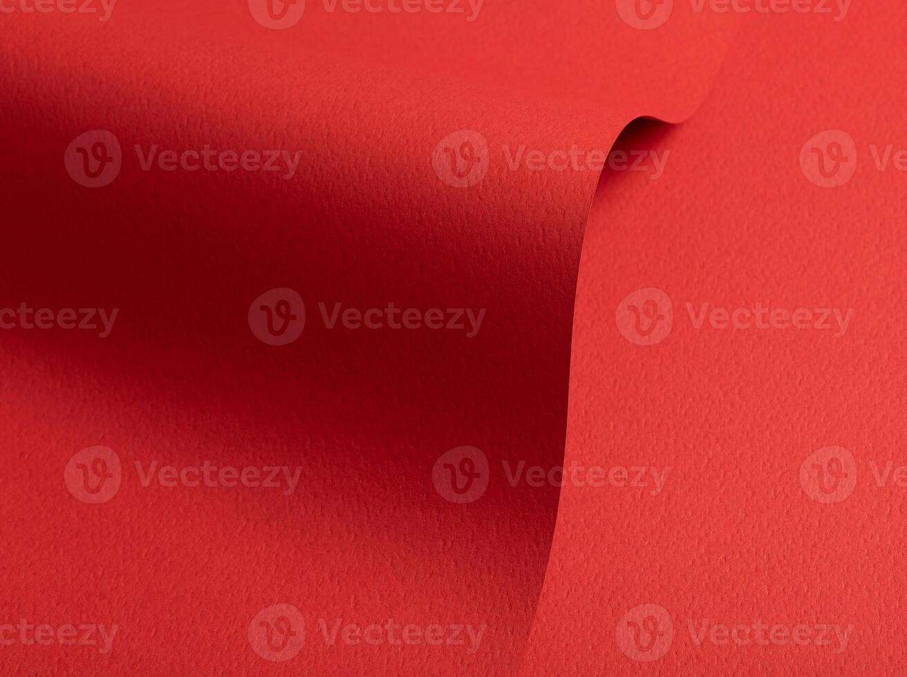 Bright red paper background with a matte texture and rough grain. Vibrant hues create an elegant, photo