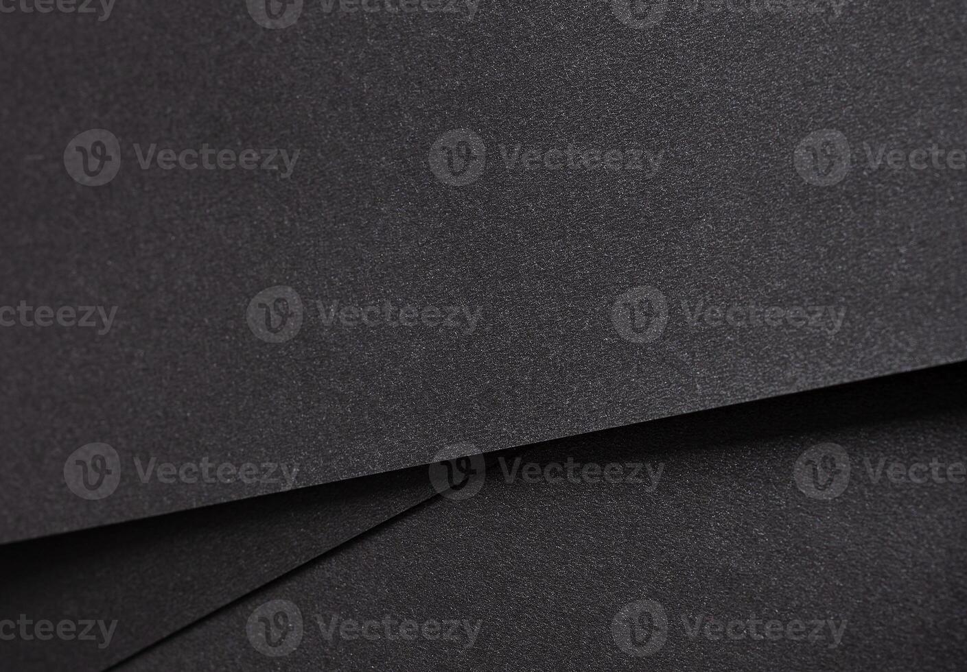 Black paper background with a textured, grainy surface and subtle geometric lines. Elegant and photo