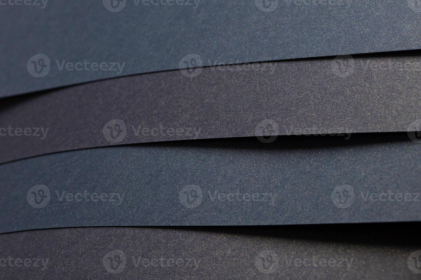 Blue and black striped paper background with a textured finish. Elegant and minimalistic, the photo