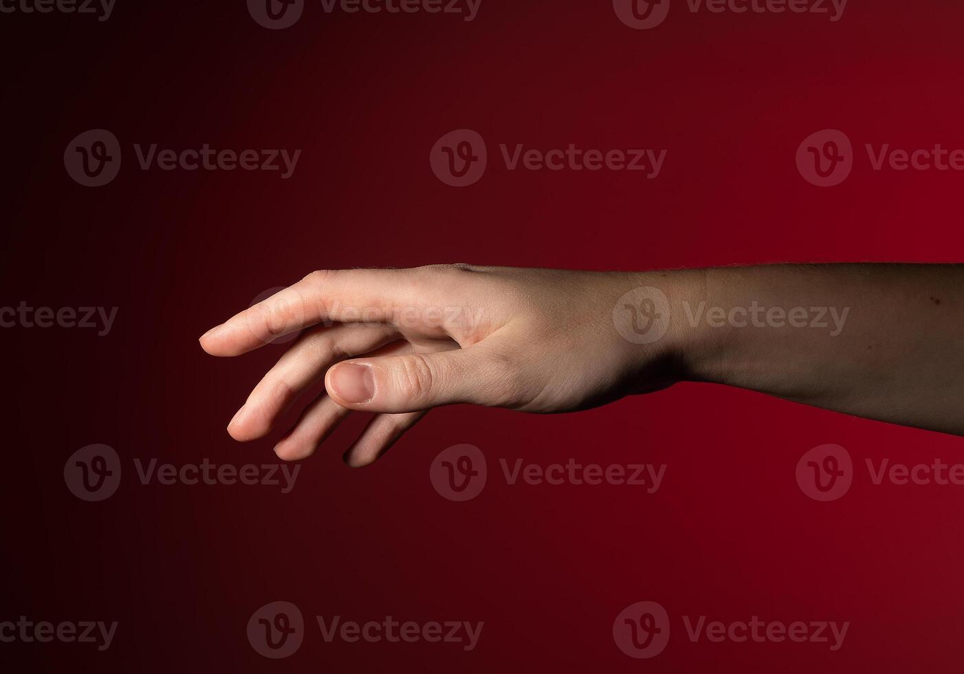 Hand reaching out, fingers gently stretching, pointing, showing subtle, graceful motion. Woman with photo