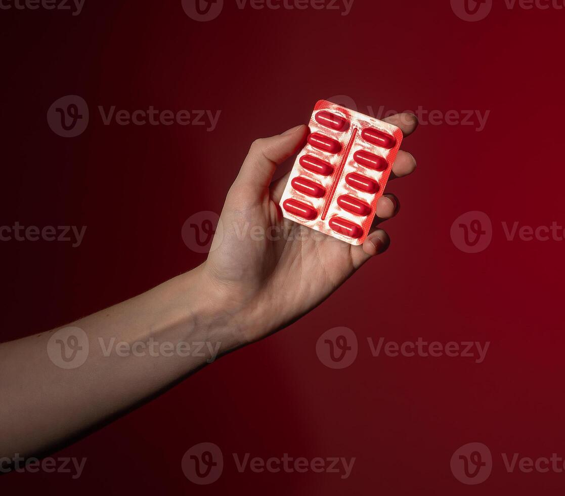 Hand holding medicine capsule, pharmaceutical treatment for healthcare and therapy. Prescription photo