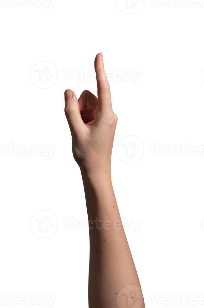 Female hand pointing with index finger extended, gesture symbolizing direction, selection, or photo