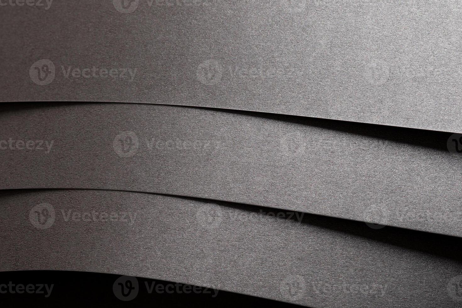 Gray metallic paper background with a pearlescent, glossy texture. Silver tones create an elegant, photo