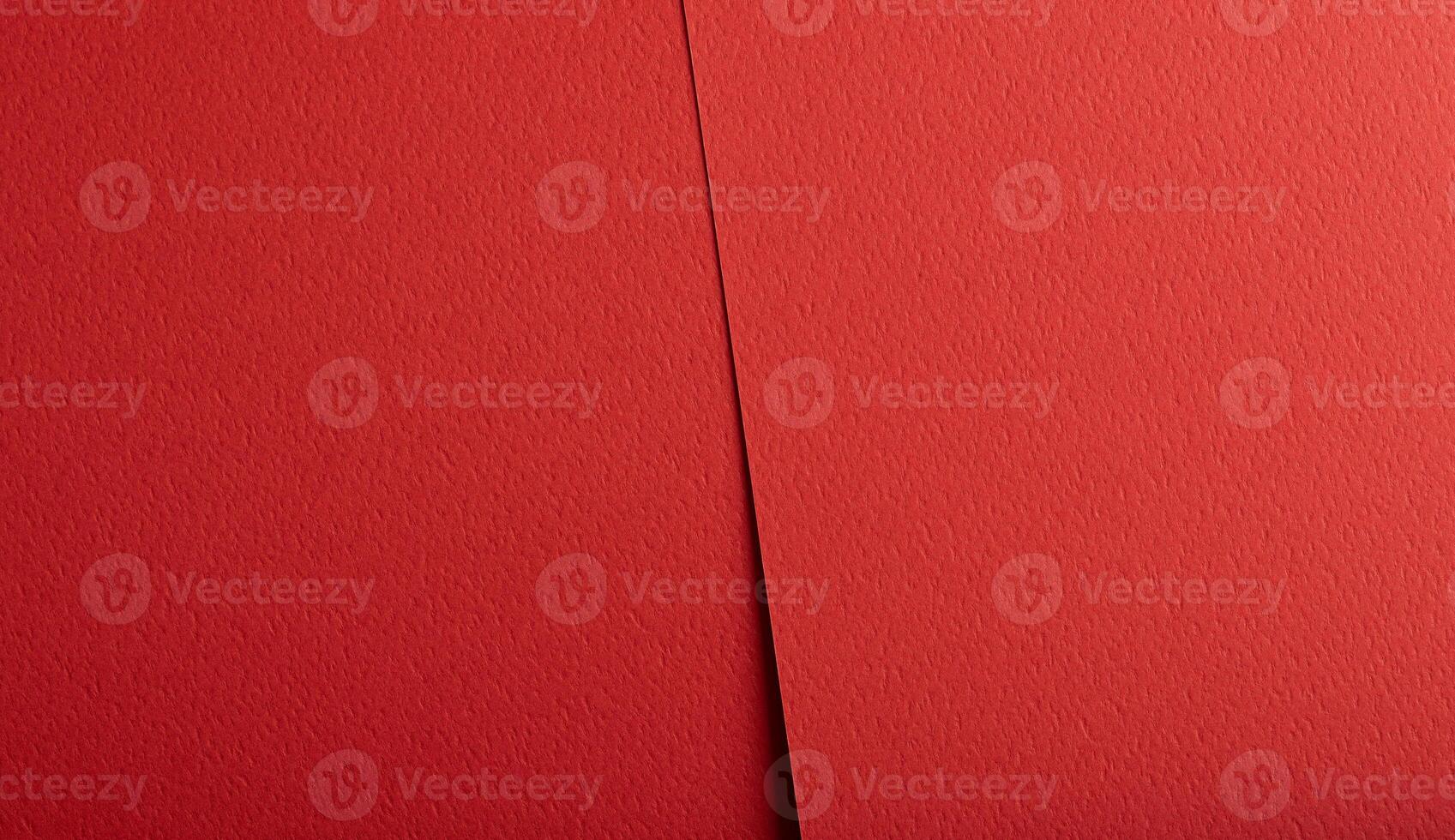 Bright red paper background with a matte texture and rough grain. Bold, vibrant tones create an photo
