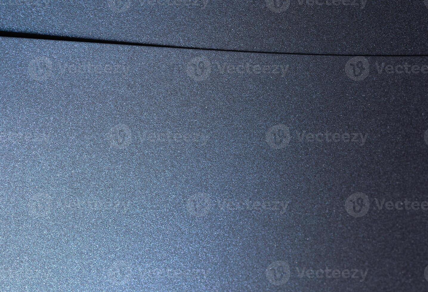 Navy blue paper background with a smooth, glossy texture and pearlescent finish. Deep, geometric photo