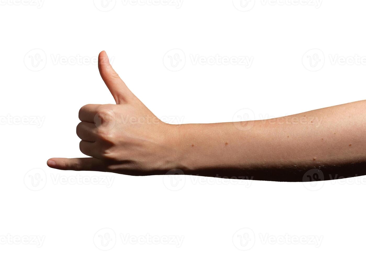 Hand making the shaka sign with thumb and pinky extended, symbolizing aloha, surfing, and relaxation photo