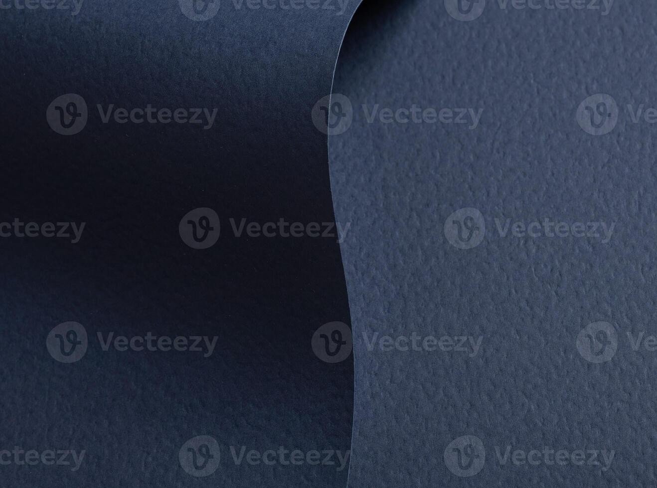 Navy blue paper background with a matte texture and rough grain. Deep, dark tones and refined photo
