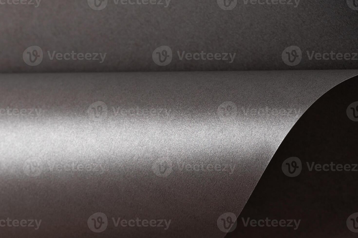 Gray metallic paper background with a pearlescent, glossy texture. Subtle silver tones create an photo