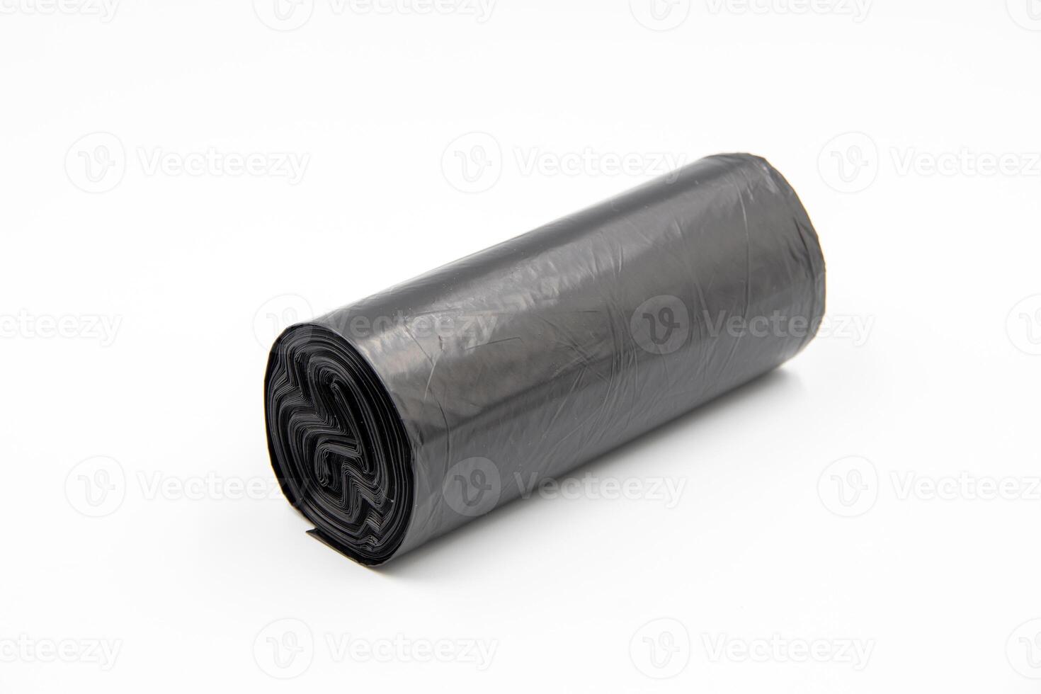 Black plastic garbage bags on white background photo