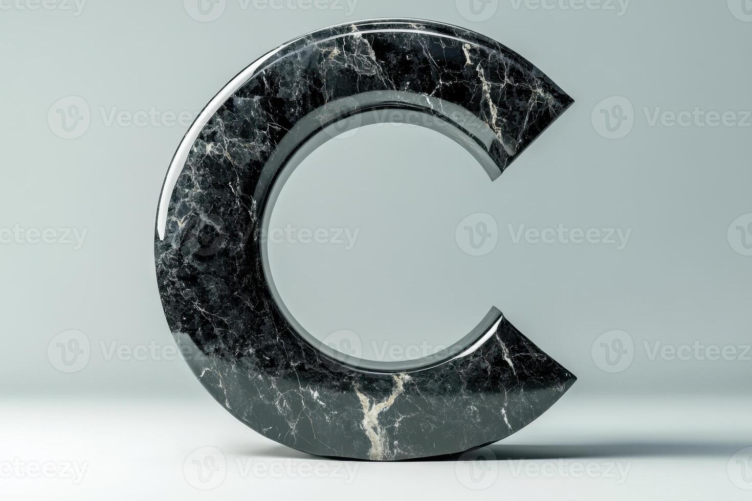 The letter C is made of marble and has a unique, curved shape photo