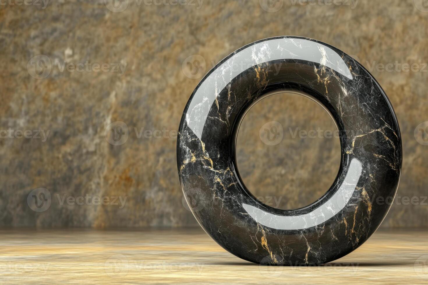 A black and gold marble with a hole in the middle photo
