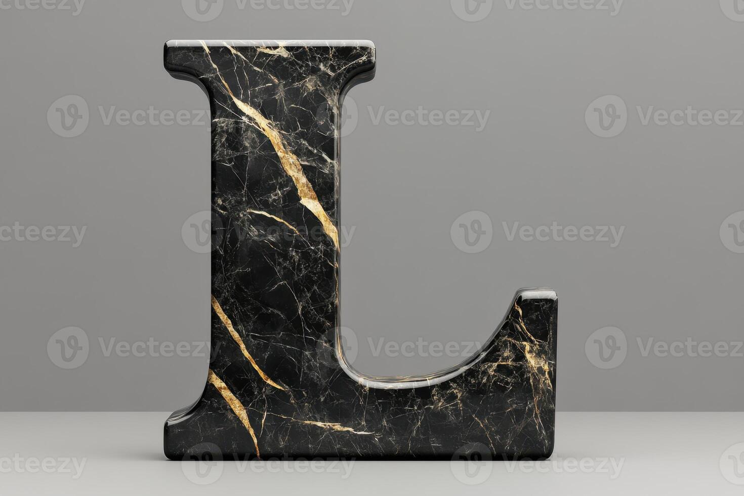 The letter L is made of marble and has a gold finish photo