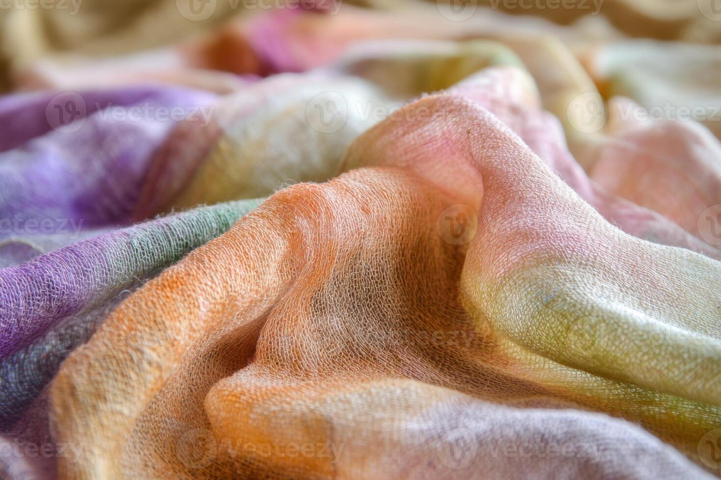 A colorful piece of fabric with a variety of colors and textures photo