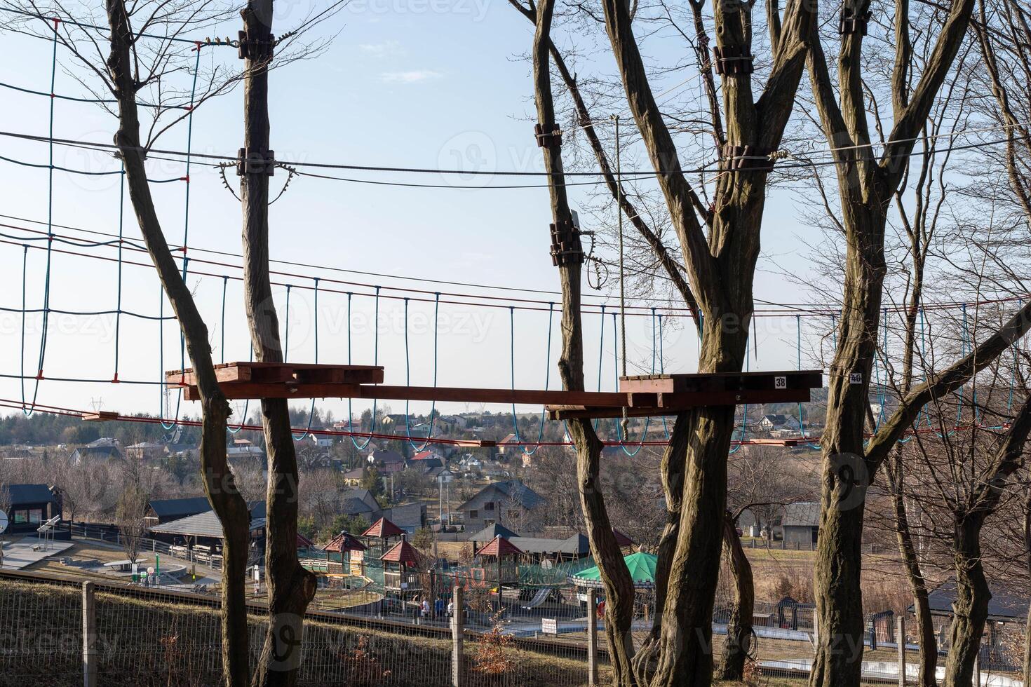 Outdoor Rope Park in Cold Season with Bare Trees and Bridges photo