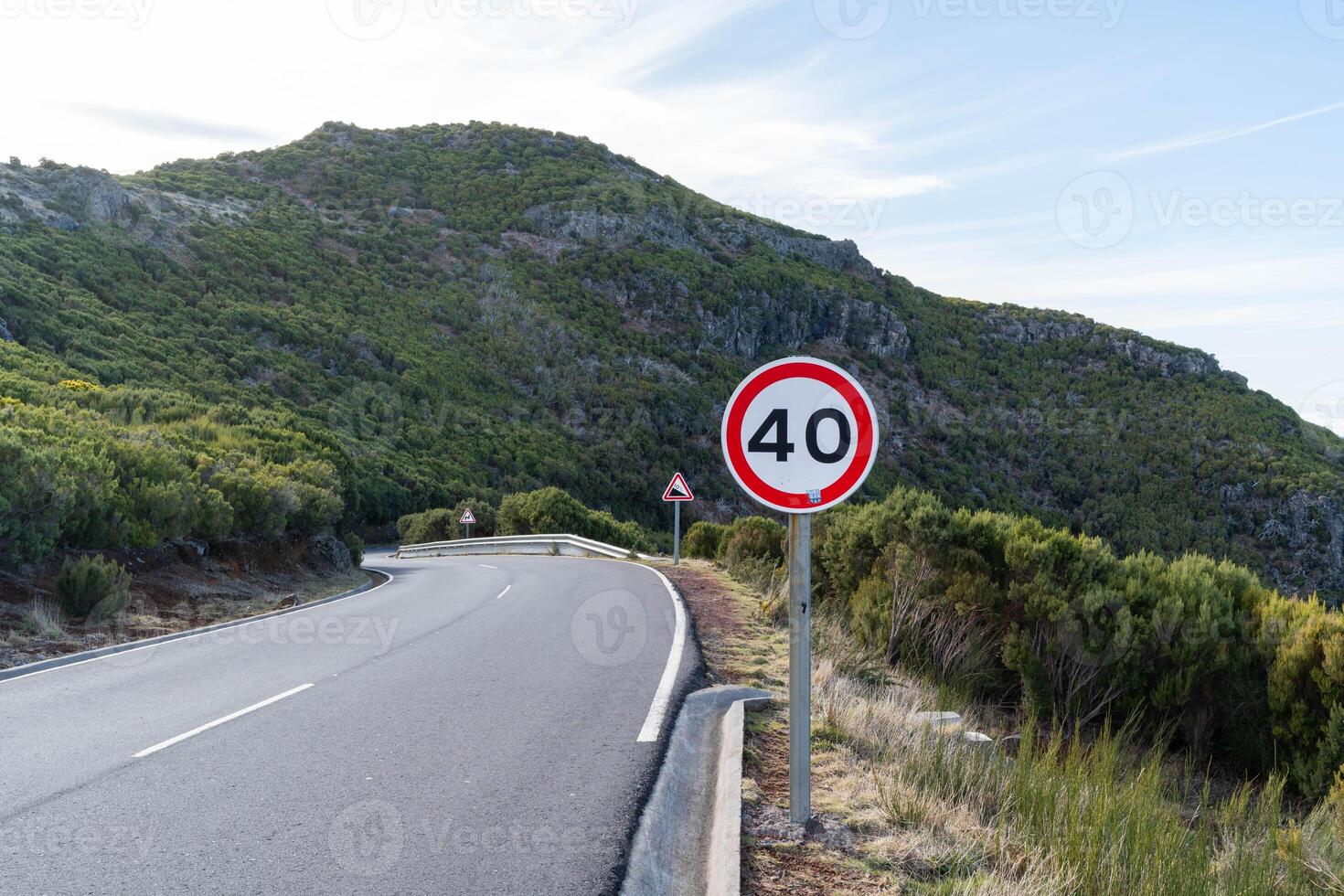 Mountain Road with Speed Limit Sign photo