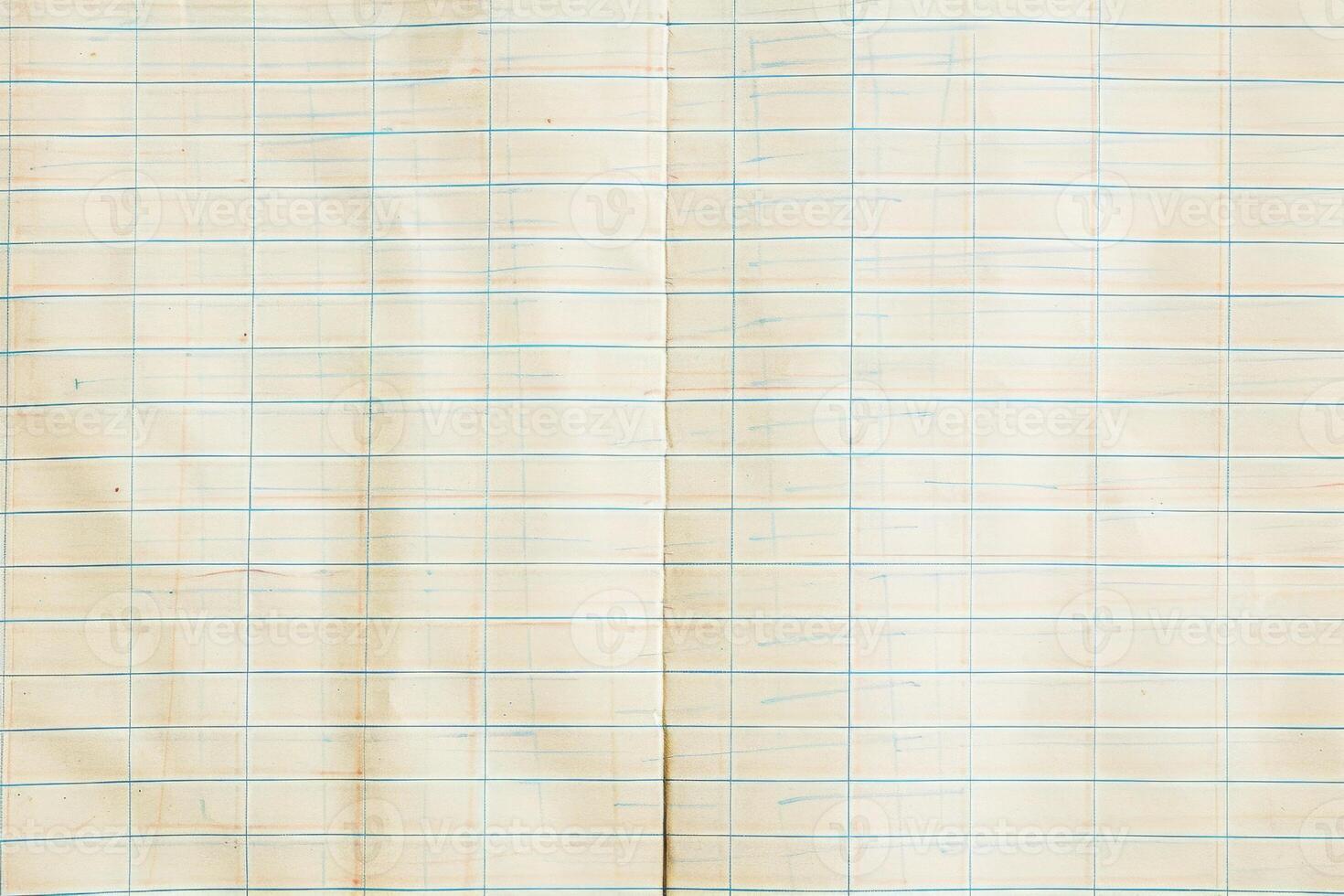 An old notebook with a grid on it photo