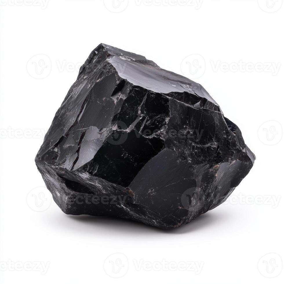 single piece of glossy obsidian with sharp edges photo